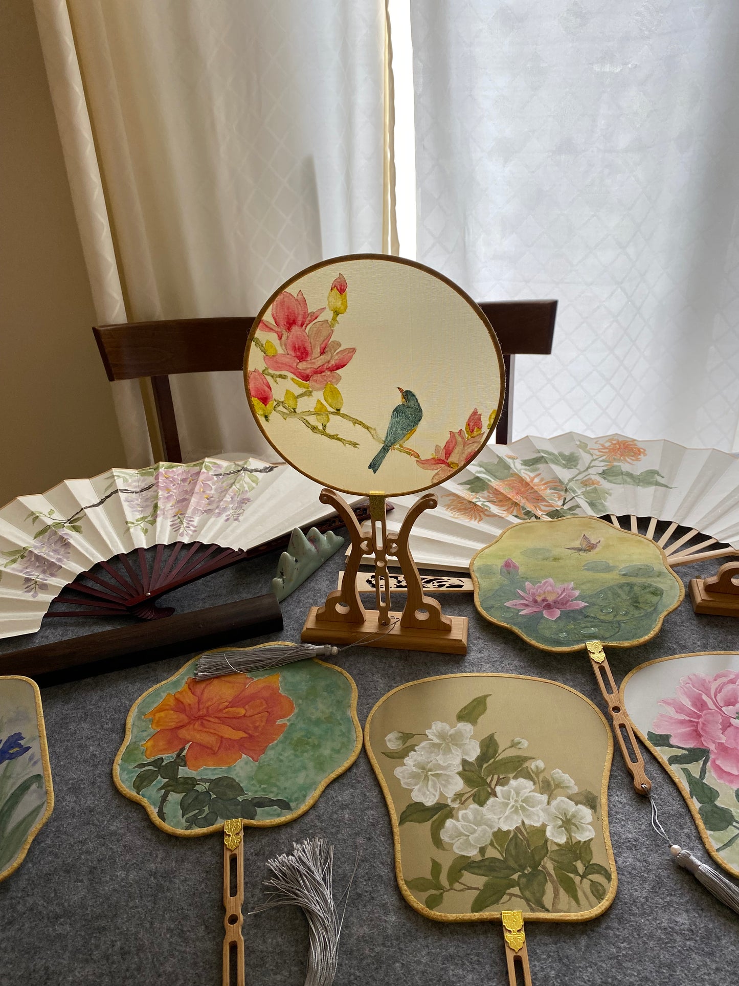 Traditional Chinese brush paintings on silk fans