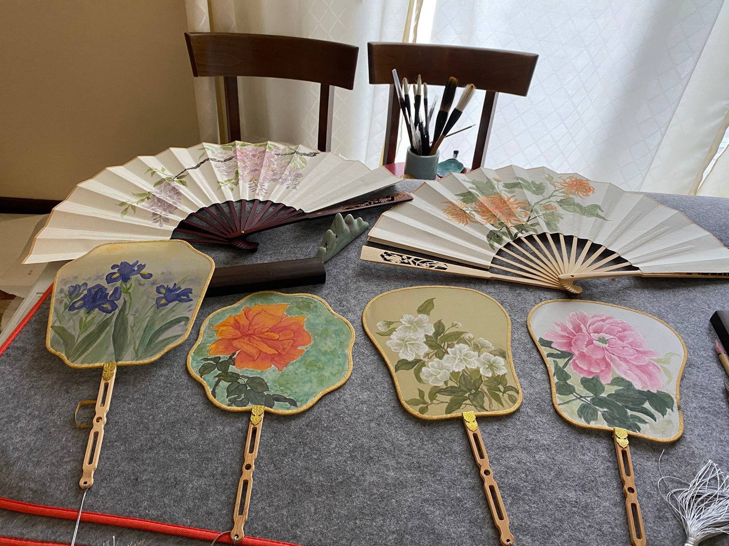 Traditional Chinese brush paintings on silk fans