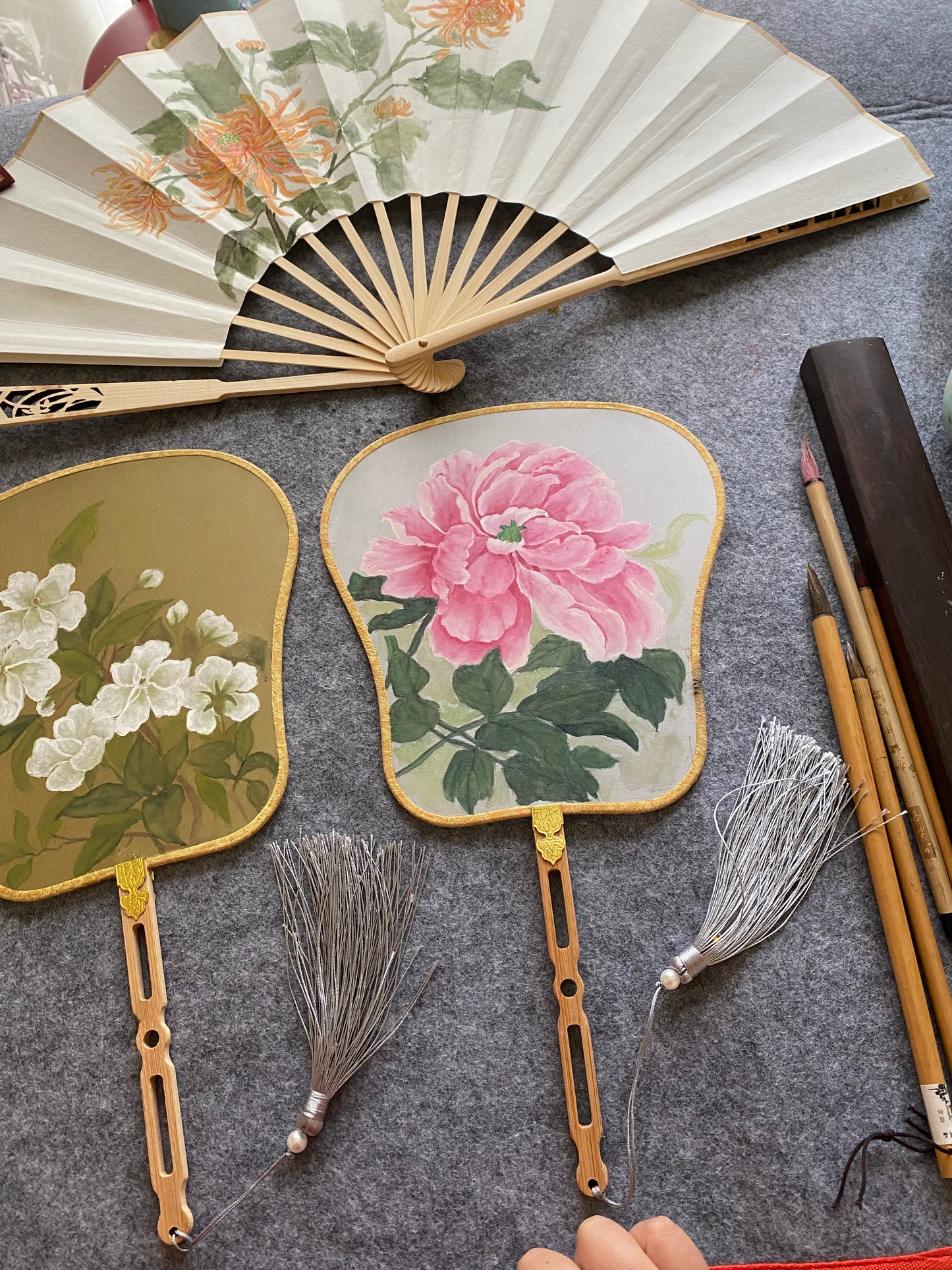 Traditional Chinese brush paintings on silk fans