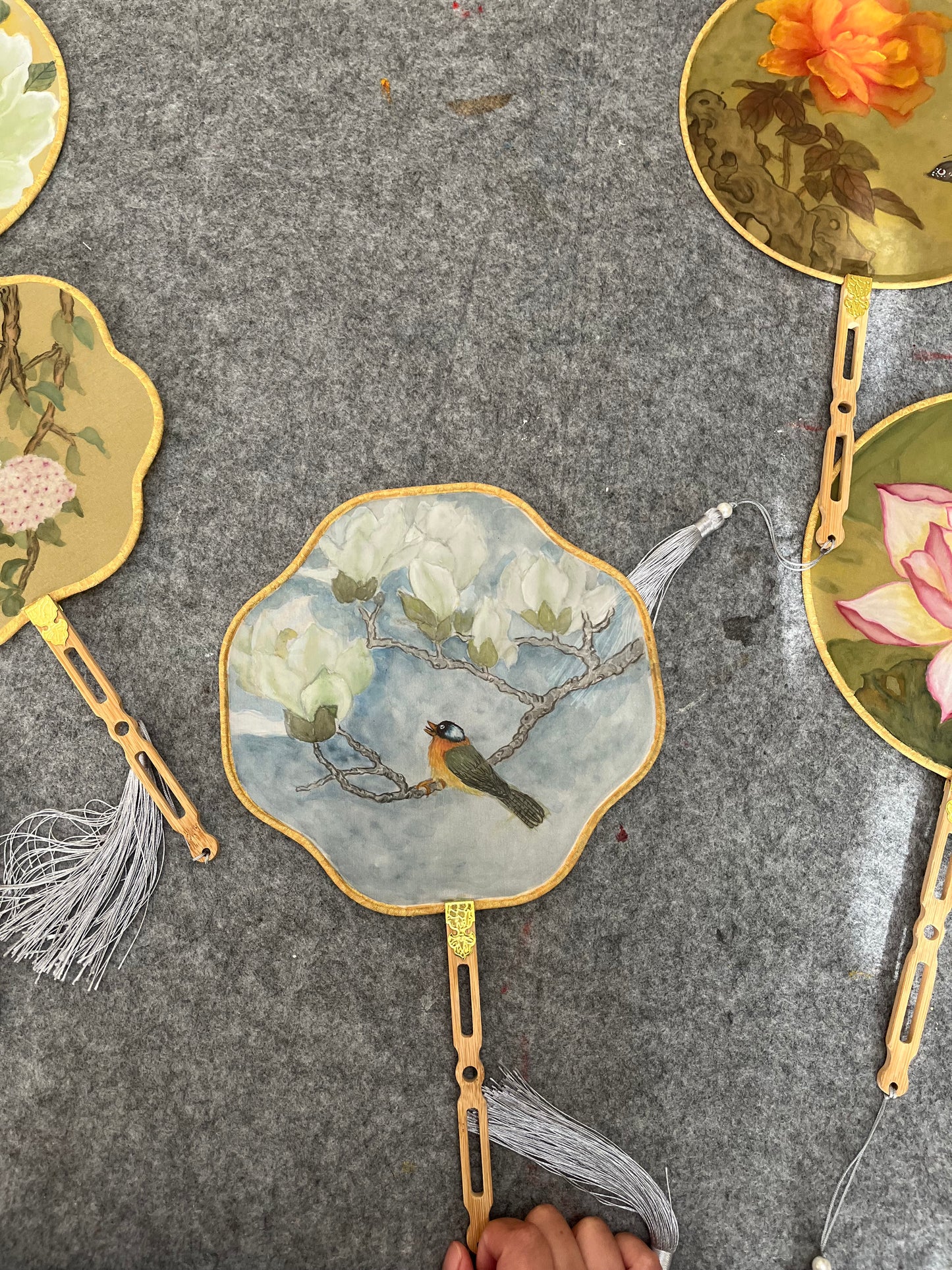 Traditional Chinese brush paintings on silk fans